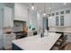 Bright and airy kitchen with a large island, stainless steel appliances, and pendant lighting at 2501 Clear Marsh Rd, Seabrook Island, SC 29455