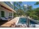 Gorgeous backyard pool with sun loungers and a view of surrounding trees at 2501 Clear Marsh Rd, Seabrook Island, SC 29455