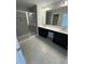 Bathroom featuring tiled shower, dual vanity sinks, and a large mirror at 280 Godwit Dr, Summerville, SC 29486