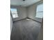 Bright bedroom features neutral paint, plush carpet, and large windows at 280 Godwit Dr, Summerville, SC 29486