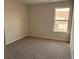 Well-lit bedroom featuring a window view of the neighborhood at 280 Godwit Dr, Summerville, SC 29486