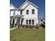 Inviting two-story home with a manicured lawn, quaint front porch, and classic curb appeal; a welcoming residence at 280 Godwit Dr, Summerville, SC 29486