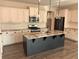 Spacious kitchen with granite countertops, an island, pendant lighting, and stainless steel appliances at 280 Godwit Dr, Summerville, SC 29486