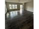 Open-concept living room with ample natural light and hardwood flooring at 280 Godwit Dr, Summerville, SC 29486