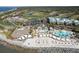 Expansive aerial view of a beach resort with pools, cabanas, and a sandy beachfront at 3005 Ocean Winds Dr, Seabrook Island, SC 29455