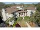 Beautiful aerial view of a condo building with palm trees and professional landscaping in a gated community at 3005 Ocean Winds Dr, Seabrook Island, SC 29455