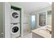 Bathroom with a stackable washer and dryer unit, step-in shower, and large vanity area at 3005 Ocean Winds Dr, Seabrook Island, SC 29455