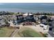 Attractive clubhouse featuring well-maintained landscaping, golf cart parking, and a circular driveway at 3005 Ocean Winds Dr, Seabrook Island, SC 29455