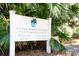 Sign for Ocean Winds Village High Hammock Road with lush tropical plants at 3005 Ocean Winds Dr, Seabrook Island, SC 29455