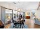 Dining room featuring large windows, a chandelier, and access to outdoor space, ideal for gatherings at 3005 Ocean Winds Dr, Seabrook Island, SC 29455