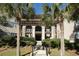 Exterior view of the home with stairs and palm trees at 3005 Ocean Winds Dr, Seabrook Island, SC 29455