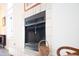 Close-up of fireplace with tile surround and hearth, showcasing a wicker basket at 3005 Ocean Winds Dr, Seabrook Island, SC 29455