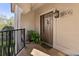 Charming front entrance of home number 3005 with a lovely brown door and potted plants at 3005 Ocean Winds Dr, Seabrook Island, SC 29455