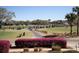 Picturesque golf course featuring a cart path lined with golf carts and beautiful landscaping at 3005 Ocean Winds Dr, Seabrook Island, SC 29455
