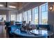 Lobby seating area with tables, chairs, luxurious blue couches, and floor to ceiling windows at 3005 Ocean Winds Dr, Seabrook Island, SC 29455