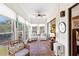 Bright sunroom with tiled floors, surrounded by windows offering serene views of the outdoors at 3005 Ocean Winds Dr, Seabrook Island, SC 29455