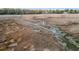 Marshy landscape with stream leading to distant houses via a long wooden boardwalk, showcasing the natural surroundings at 3020 Plumier Pl, Charleston, SC 29414