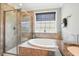 Bathroom with glass-enclosed shower and tub, plus granite counters and sleek fixtures at 3020 Plumier Pl, Charleston, SC 29414