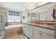 Bathroom boasting a soaking tub, double vanity, tile flooring, and stylish fixtures at 3020 Plumier Pl, Charleston, SC 29414