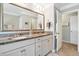 Bathroom with dual sinks, granite countertop and great mirror and cabinetry at 3020 Plumier Pl, Charleston, SC 29414