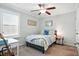 Serene bedroom with natural light, ceiling fan, carpet flooring, and comfortable furnishings at 3020 Plumier Pl, Charleston, SC 29414