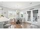 Cozy breakfast nook with a built-in bench, table, and view of the backyard, perfect for Gathering meals at 3020 Plumier Pl, Charleston, SC 29414