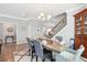 Elegant dining room featuring a farmhouse-style table, upholstered chairs, and stylish decor at 3020 Plumier Pl, Charleston, SC 29414