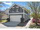 Exterior of a two-story house featuring a garage and neutral siding at 3020 Plumier Pl, Charleston, SC 29414