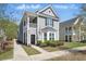 Charming two-story home with a cozy front porch and beautifully landscaped front yard at 3020 Plumier Pl, Charleston, SC 29414