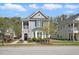 Charming two-story home with a cozy front porch and beautifully landscaped front yard at 3020 Plumier Pl, Charleston, SC 29414