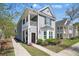 Charming two-story home with a cozy front porch and beautifully landscaped front yard at 3020 Plumier Pl, Charleston, SC 29414