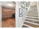 View of the garage and stairs with wooden steps and white risers at 3020 Plumier Pl, Charleston, SC 29414