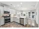 Bright kitchen with white cabinets, stainless steel appliances, a farmhouse sink, and a subway tile backsplash at 3020 Plumier Pl, Charleston, SC 29414