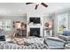 Comfortable living room with fireplace, TV, and coastal-themed decor, perfect for relaxation and entertaining at 3020 Plumier Pl, Charleston, SC 29414