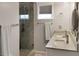 Modern bathroom with double sinks, granite countertop, and walk in tiled shower at 3025 Lazarette Ln, Charleston, SC 29414