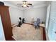 Bright bonus room features neutral walls, exercise bike, and a charming accent chair for flexible living at 3025 Lazarette Ln, Charleston, SC 29414