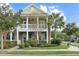 Charming two-story home with brick facade, double porches, and lush landscaping at 3025 Lazarette Ln, Charleston, SC 29414