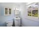 Well-lit bathroom featuring a vanity, toilet, and storage, creating a functional and stylish space at 311 Black St, Walterboro, SC 29488