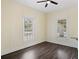 Cozy bedroom featuring hardwood floors, crisp walls, and a ceiling fan at 311 Black St, Walterboro, SC 29488