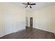 Bedroom showcasing hardwood floors, crisp walls, and a fireplace at 311 Black St, Walterboro, SC 29488