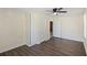 Bedroom showcasing a ceiling fan, closet, and doorway, blending comfort and practical storage solutions at 311 Black St, Walterboro, SC 29488