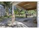 Attached carport features brick columns and a wood-paneled ceiling with fluorescent lighting at 311 Black St, Walterboro, SC 29488
