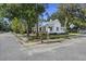 Exterior view of home showing metal roof, landscaping, and street with crosswalk at 311 Black St, Walterboro, SC 29488