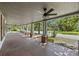 Spacious front porch, perfect for relaxing, offers a wide view of the neighborhood and surrounding greenery at 311 Black St, Walterboro, SC 29488