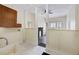 Utility room showcasing open access to the living room with a view of the fireplace at 311 Black St, Walterboro, SC 29488