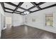 Sunlit living room with hardwood floors, coffered ceilings, a fireplace, and built-in shelving at 311 Black St, Walterboro, SC 29488