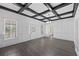 Light-filled living room featuring hardwood floors and coffered ceilings at 311 Black St, Walterboro, SC 29488