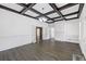 Bright living room with hardwood floors, coffered ceilings, a fireplace, and plenty of natural light at 311 Black St, Walterboro, SC 29488