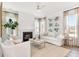 Cozy living room with a fireplace, neutral décor, and plenty of natural light at 316 Archar St, Summerville, SC 29486