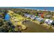 Stunning lagoon-front home with golf course views nestled among lush trees, offering privacy and access to beachfront at 3419 Myrtle St, Edisto Island, SC 29438